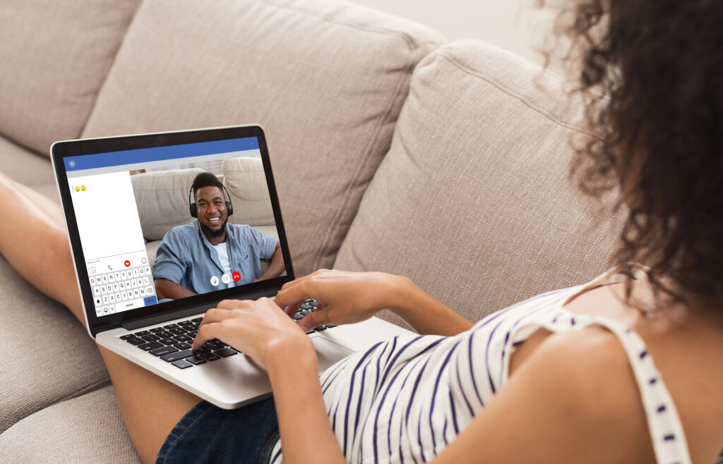 Woman chatting on her computer with a man